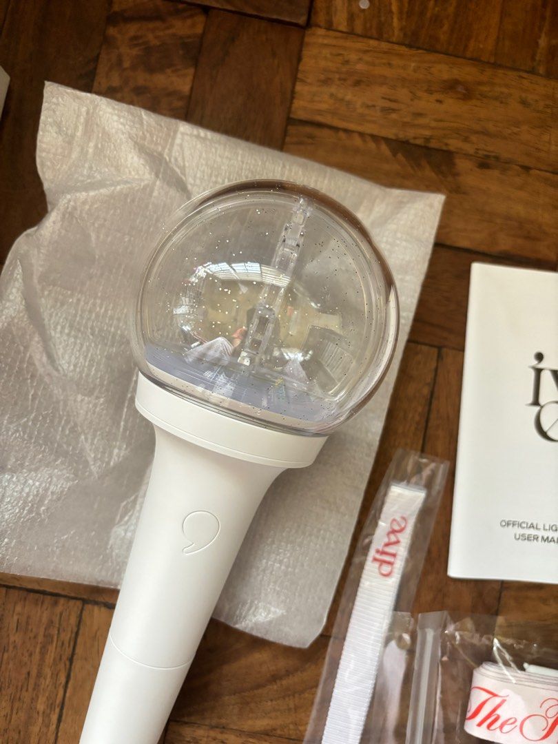 IVE Lightstick (Category: Music Accessories) located in Quezon City. Submitted by franceseeeeee (Listing ID 1330905576, Image 2). Description: - used the lightstick once on concert only - dirty box since nakatambak lang - free holder strap (new, di nadala jung concert) - free shipping through Gogo Xpress RFS: declutter.
