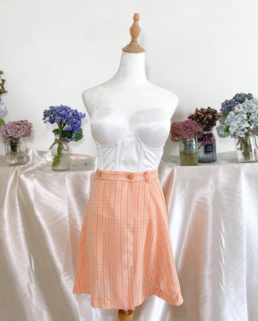 orange plaid skirt (Category: Skirts) located in Quezon City. Submitted by emptygrounds (Listing ID 1330992547, Image 1). Description: ✨ 27” WAIST ✨ lined, buttons are functional.
