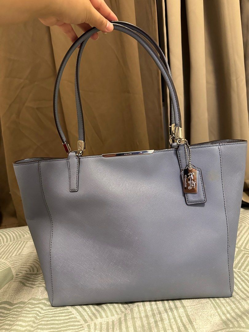 Coach Tote bag (Category: Luxury Bags & Wallets) located in Malabon City. Submitted by zyrabojos (Listing ID 1331223476, Image 1). Description: Coach Tote bag in Saffiano leather Still in good condition with just light stain All hardwares are in excellent condition.