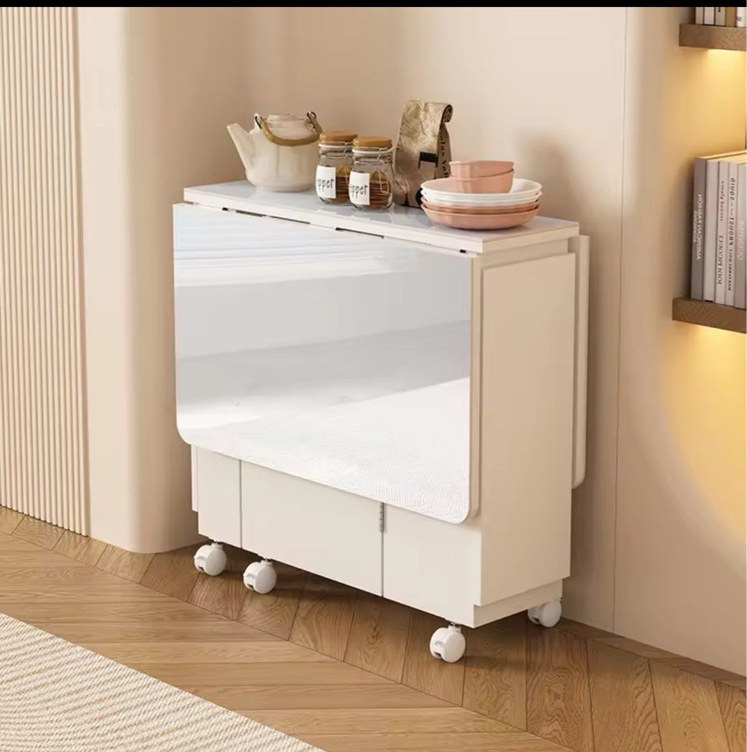 Foldable Table (Category: Tables & Sets) located in Singapore. Submitted by ajitarote (Listing ID 1331187319, Image 2). Description: Simple Folding Table Dining Table Small Apartment Home 4 Multi-Functional Retractable Dining Table with Drawer Rectangular Sideboard Cabinet.