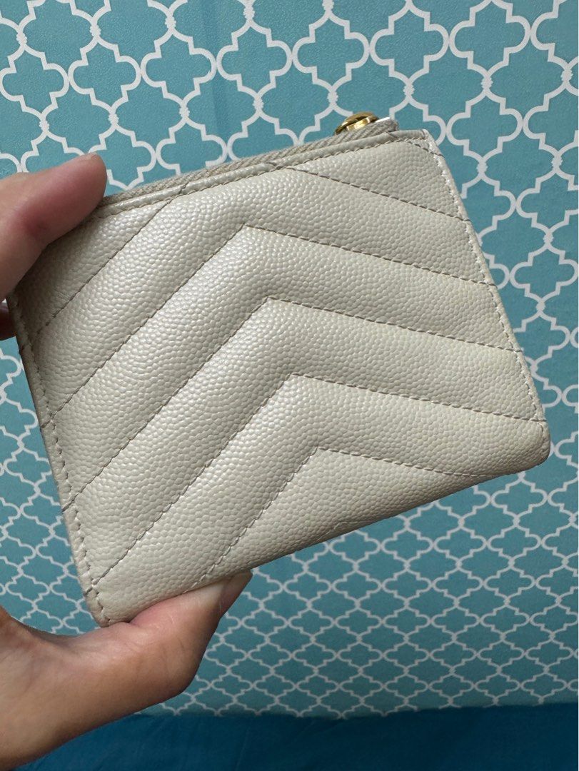 SUPER SALE!!! YSL Compact Wallet (Category: Luxury Bags & Wallets) located in Taguig. Submitted by anniething.goes (Listing ID 1331168632, Image 3). Description: Excellent condition 9/10 Bifold with bills and coin compartment Off white, GHW Comes with dustbag and cards Selling low!!! All sales are final‼️ No joy reservers‼️ No low ballers‼️ All sales are final, no return no exchange no refund unless proven fake‼️.