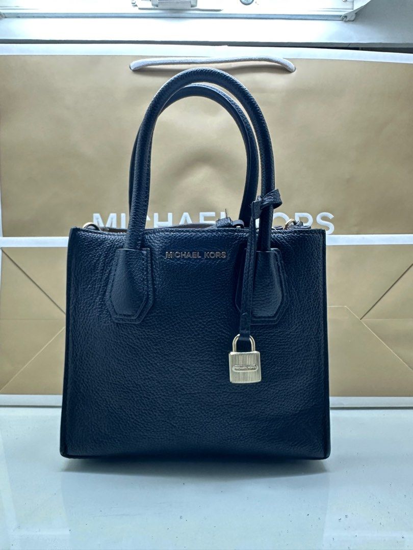 Michael Kors (Category: Luxury Bags & Wallets) located in Taguig. Submitted by biancasells_ (Listing ID 1331166296, Image 1). Description: Decluttering - original MK mercer bag small (leather) Bought for 16k Comes with bag strap/ paper bag, care card.