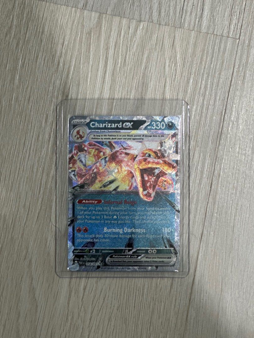 stage 2 dragonite pokemon card Pokémon TCG: Paldean Fates Tin – Charizard ex