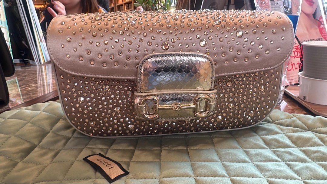 Authentic Gucci horsebit swarovski bag (Category: Luxury Bags & Wallets) located in Rosales. Submitted by mcosue1. (Listing ID 1331416987, Image 1). Description: Brand new 2024 Gucci horsebit limited edition bag!! ❤️ Complete inclusions w/ receipt Swarovski crystal w/ exotic snake trim Bought Gucci Dubai 16,450 AED 256,000 pesos.