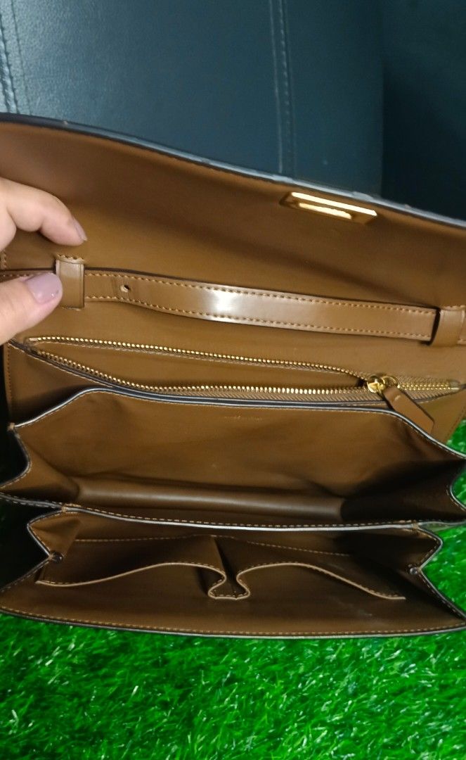Celine box sling bag (Category: Luxury Bags & Wallets) located in Legazpi City. Submitted by georgepineda791 (Listing ID 1331553851, Image 2). Description: Preloved Celine Box Sling Bag made of durable, hard leather with gold hardware and a code inside the pocket. Can be worn as a shoulder or crossbody bag. It shows very minimal signs of usage. There are some pressed marks on the rubber linings and a few areas, but they’re not noticeable unless c