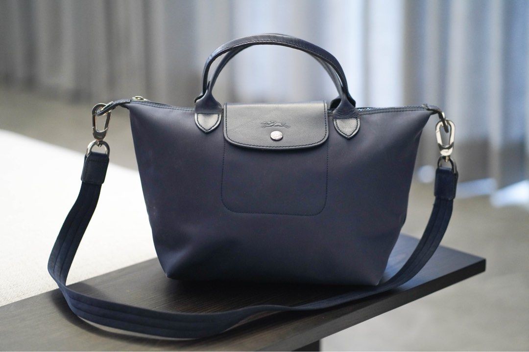 Longchamp Le Pliage Neo - Navy Blue (Category: Luxury Bags & Wallets) located in Angeles City. Submitted by mkp125 (Listing ID 1331409994, Image 1). Description: - authentic - well-loved bag so the leather at the edges has signs of use, will look better if cleaned further - 25x23x16 cm - has some molds inside but can still be cleaned (last photo) - price reflects condition but the zipper, hardware, and bag exterior is in good condition - payment 