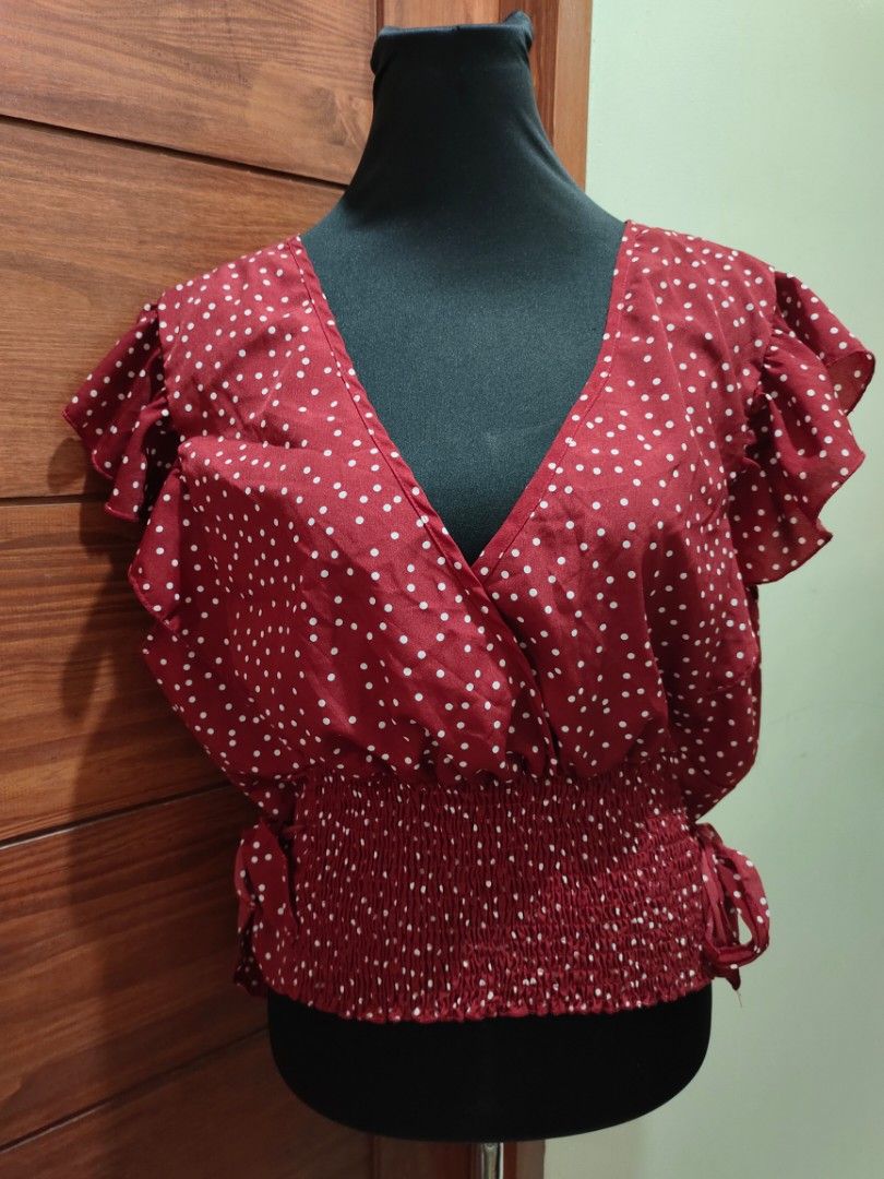Red polka formal top with side tie (Category: Blouses) located in Paranaque City. Submitted by expectmore.payless (Listing ID 1331467452, Image 1). Description: brandnew never nagamit - ang ganda nito perfect pang xmas or new year outfit kaso di kasya sakin :( fits 2XL and up.