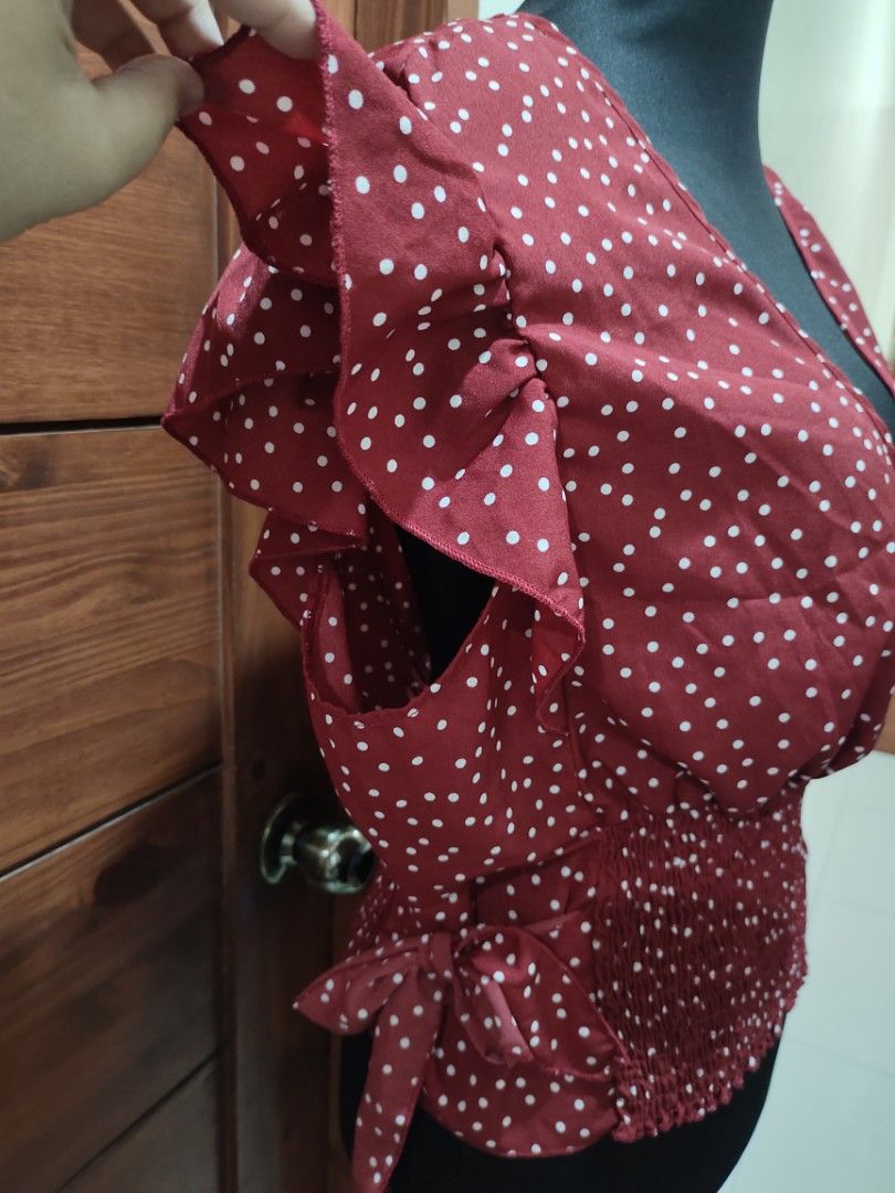 Red polka formal top with side tie (Category: Blouses) located in Paranaque City. Submitted by expectmore.payless (Listing ID 1331467452, Image 3). Description: brandnew never nagamit - ang ganda nito perfect pang xmas or new year outfit kaso di kasya sakin :( fits 2XL and up.