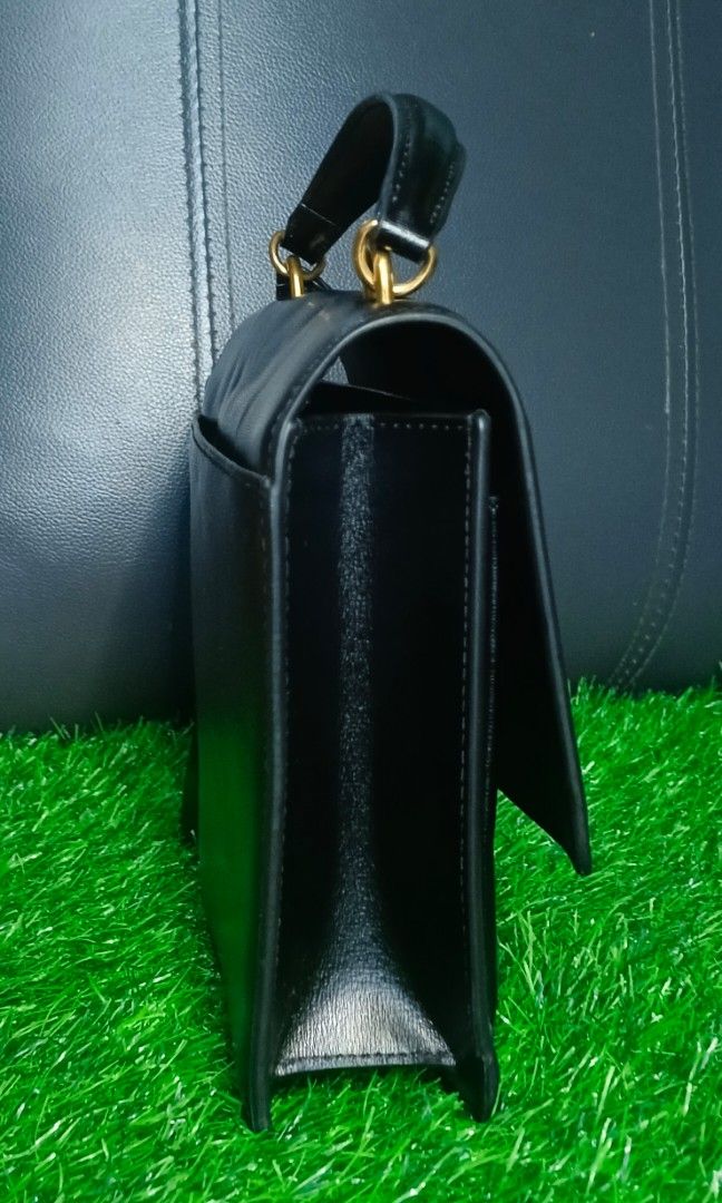 YSL handbag (Category: Luxury Bags & Wallets) located in Legazpi City. Submitted by georgepineda791 (Listing ID 1331498222, Image 2). Description: Preloved YSL Handbag: Made of high-quality leather with gold hardware and a code inside the pocket. Although the original strap is missing, you can easily add a strap to wear it as a crossbody. The bag shows visible signs of usage, such as pressed marks on the leather and rubber linings, but it is stil