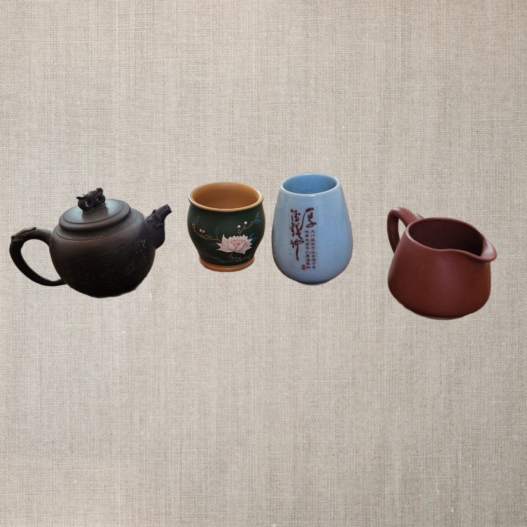 Authentic Chinese Handmade Tea Cup and Tea Pot Set (4pcs) (Category: Coffee & Tea Tableware) located in Manila. Submitted by lachinitasph_ (Listing ID 1328657490, Image 1). Description: this set includes: 🟥 Chinese Yixing Zisha clay teapot: dragon pot gu jingzhou - has minimal crack on the lid (pls see photo) 🟥 Chinese Dynasty Song Moon white glaze porcelain tea jar 🟥 Yixing Clay Fair Cup, Gong Dao Bei 🟥 Hand painted green ceramic tea cup.