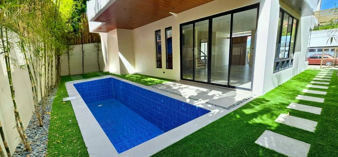 BF Homes Brand New Modern House with Pool (Category: House & Lot) located in Manila. Submitted by mariaelena.npacunayen (Listing ID 1328604209, Image 1). Description: Brand New House with Pool Modern Two Storey Lot Size 280 sqm Floor 400 sqm Single Detached Five Bedrooms with Four Toilet and Bath Four Car Garage His and Hers Walk In Closet 12 Feet High Ceiling Kohler Bathroom Fixtures Maid's and Driver's Room with Toilet and Bath Swimming Pool P4