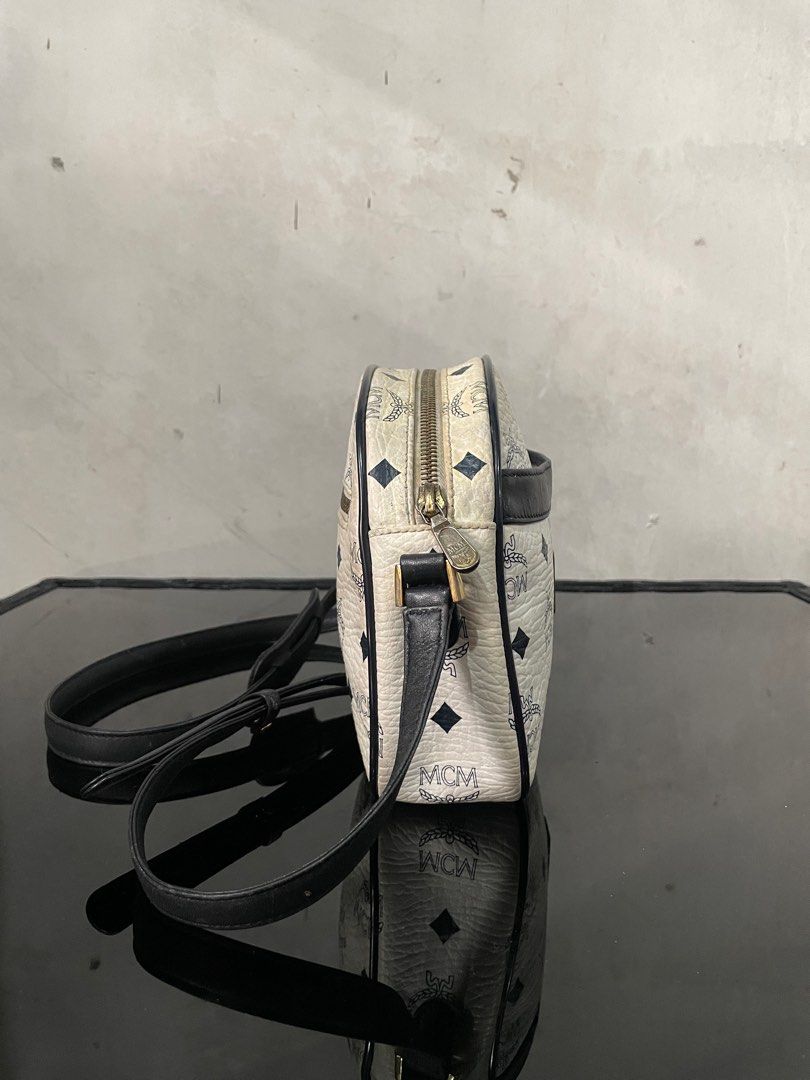 Mcm White Sling Bag (Category: Luxury Bags & Wallets) located in Quezon City. Submitted by Prive_Online (Listing ID 1328641394, Image 3). Description: WTS! - -Mcm White Sling Bag -Guaranteed Authentic -Germany -Dimensions: L 9.5in x H 6in x W 3in -Adjustable Strap -Leather inside turns into suede due to expiration -Signs of use -Needs proper bag spa -Slight yellowing - 3,500 + Sf - Loc: Fairview Dm.