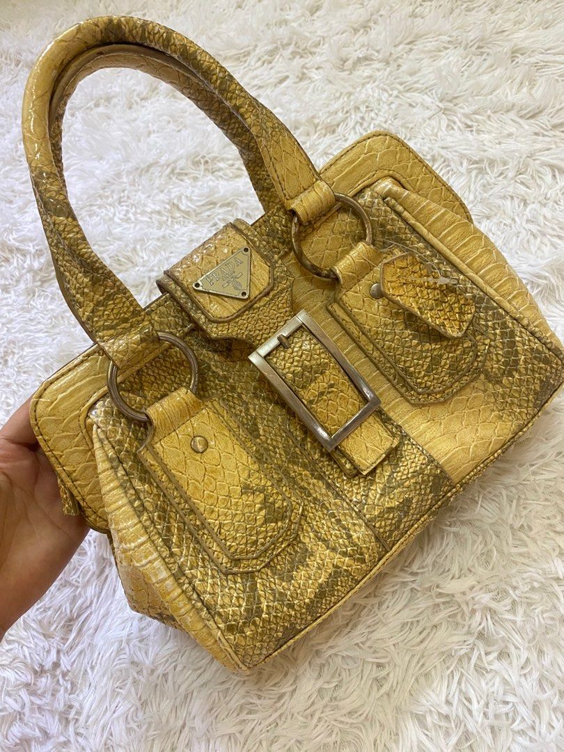 Prada Milano Bag (Category: Luxury Bags & Wallets) located in Diadi. Submitted by vaffiqvri (Listing ID 1328725418, Image 2). Description: 🎀NO COD!! 🎀Pattern and texture: Python leather bag 🎀Condition: 9/10 🎀True color: yellow 🎀Shipping via flash express or j&t (depends on your liking) 🎀STILL NEGOTIABLE GOOO .