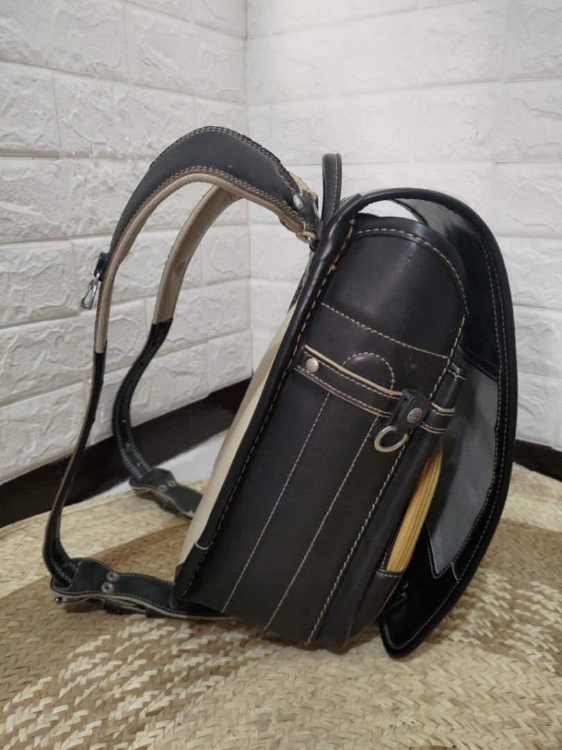 Preloved Randoseru Japan Black Bag (Category: Backpacks) located in Muntinlupa City. Submitted by solluna11 (Listing ID 1328663019, Image 3). Description: 7/10 Condition Flaws in the strap and inside the bag Location: Muntinlupa Can ship via Lalamove or J&T Express.