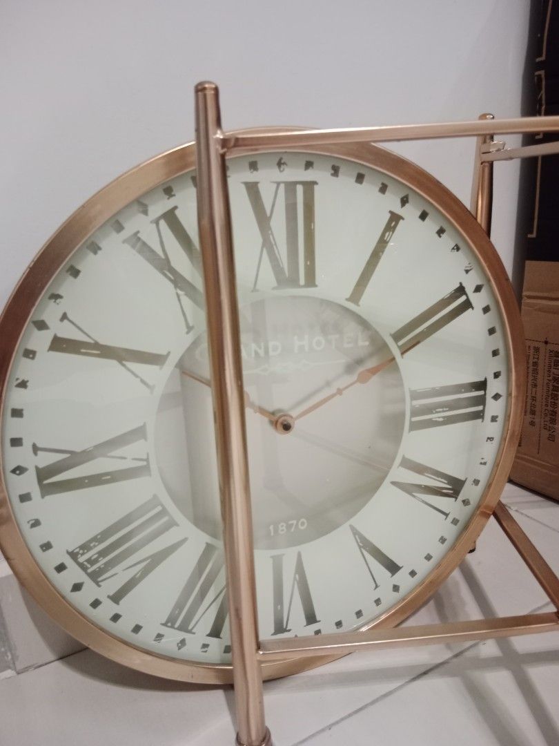 Table Clock (Category: Clocks) located in Kuala Lumpur. Submitted by creative_criteria (Listing ID 1328727637, Image 3). Description: - Size: 46cm (Diameter) x 47cm (Height) - Material: Metal + Glass Surface - Color: Gold + White + Silver - Can use as table, clock or deco depend on your creativity.