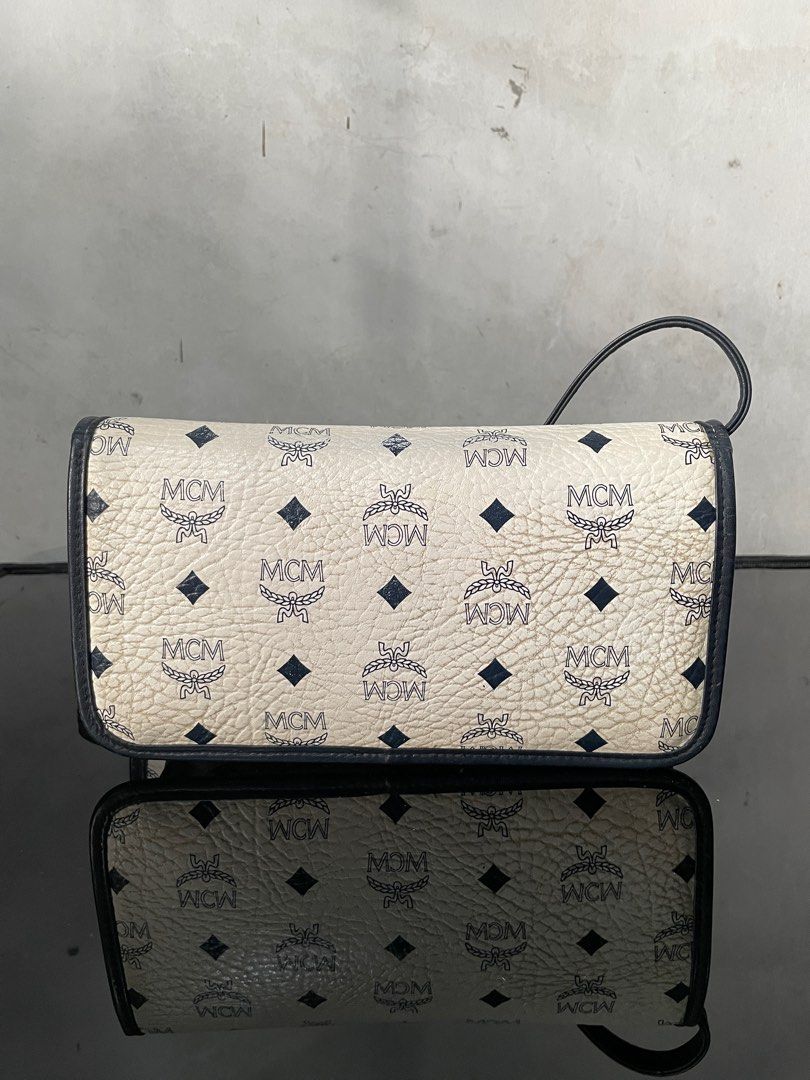 Vintage MCM White Flap Sling Bag (Category: Luxury Bags & Wallets) located in Quezon City. Submitted by Prive_Online (Listing ID 1328641072, Image 2). Description: WTS! - -Vintage MCM White Flap Sling Bag -Guaranteed Authentic -Germany -Dimensions: L 9.5 in x H 5.5 in x W 3 in -Good condition -Need a proper bag spa -Issues: Yellowing some ares, signs of use, need bag spa - 3,500 + Sf - Loc: Fairview Dm .