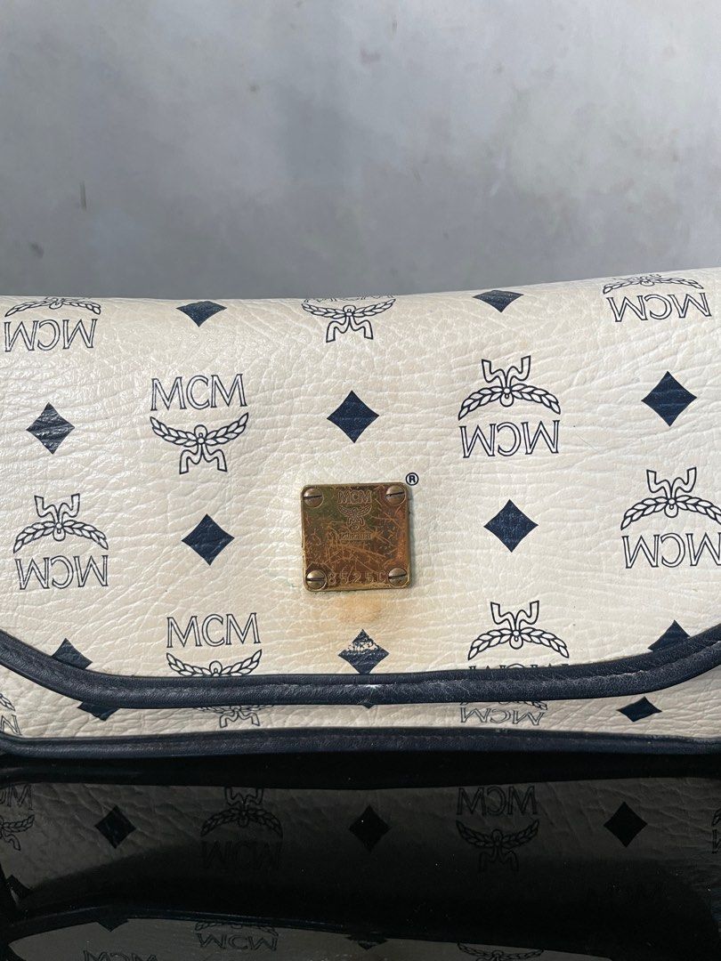 Vintage MCM White Flap Sling Bag (Category: Luxury Bags & Wallets) located in Quezon City. Submitted by Prive_Online (Listing ID 1328641072, Image 3). Description: WTS! - -Vintage MCM White Flap Sling Bag -Guaranteed Authentic -Germany -Dimensions: L 9.5 in x H 5.5 in x W 3 in -Good condition -Need a proper bag spa -Issues: Yellowing some ares, signs of use, need bag spa - 3,500 + Sf - Loc: Fairview Dm .