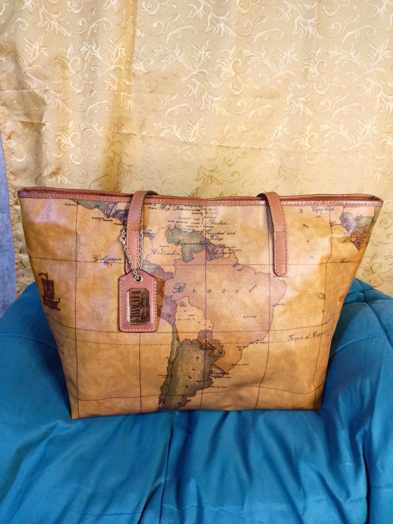 Alviero Martini Map Bag Authentic (Category: Luxury Bags & Wallets) located in Manila. Submitted by mybellacloset158 (Listing ID 1331898409, Image 1). Description: Authentic Alviero Martini T Classe Tote Bag, Sobrng ganda nya. No flaws, good as new, pweding ipang Regalo. Large size. Measurements: Width-16.5" Height-11" Depth- 4.5".