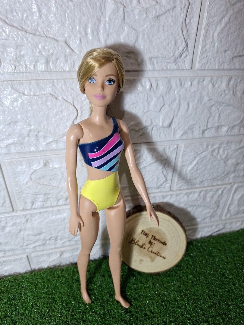 Barbie Mattel authentic (Category: Kids Toys) located in Cavite. Submitted by Mavee (Listing ID 1331824840, Image 2). Description: Barbie mattel in built in swimwear, ganda ng hair nito extra soft, flaws ung pentel sa batok, pero medyo tight pa din joints🩷 dami ko na extra kaya letting go personal collection ko din🥰with markings orig'.