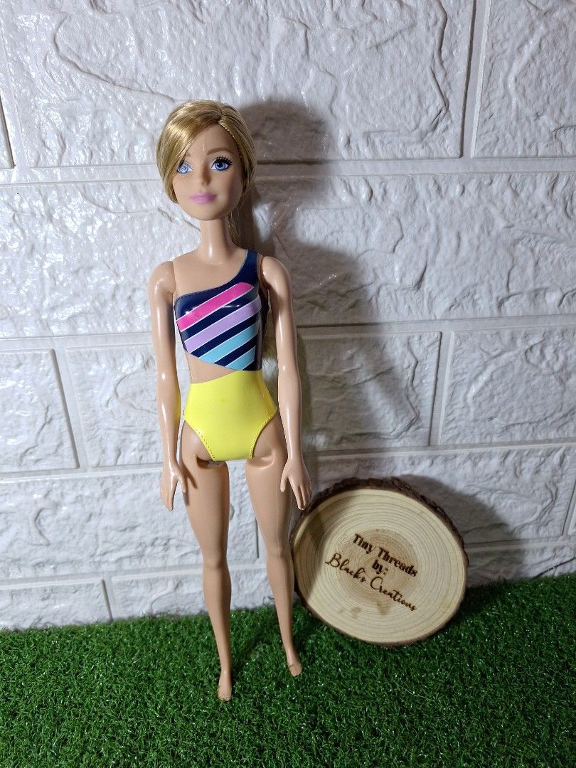 Barbie Mattel authentic (Category: Kids Toys) located in Cavite. Submitted by Mavee (Listing ID 1331824840, Image 1). Description: Barbie mattel in built in swimwear, ganda ng hair nito extra soft, flaws ung pentel sa batok, pero medyo tight pa din joints🩷 dami ko na extra kaya letting go personal collection ko din🥰with markings orig'.