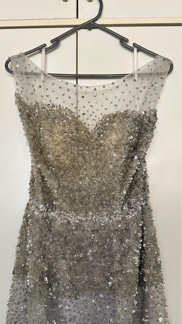 Gray sequin gown (Category: Evening Dresses & Gowns) located in Subang Jaya. Submitted by jedimonster (Listing ID 1304924321, Image 2). Description: Bought this from another carouseller new and accordingly worth almost 1k. I never worn coz no event to go too 😅 Heavy dress, long fish tail and gorgeous. Esp if you love sequins and blinks you will love this. .