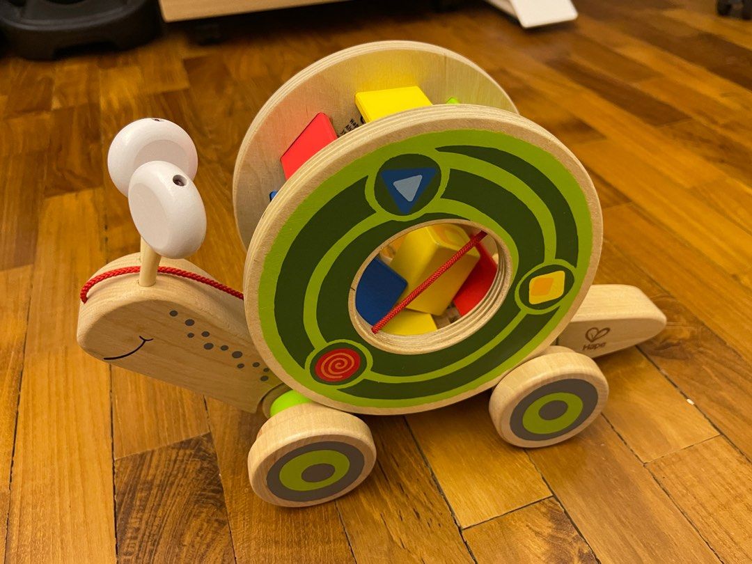 Hape pull along snail and shape sorter