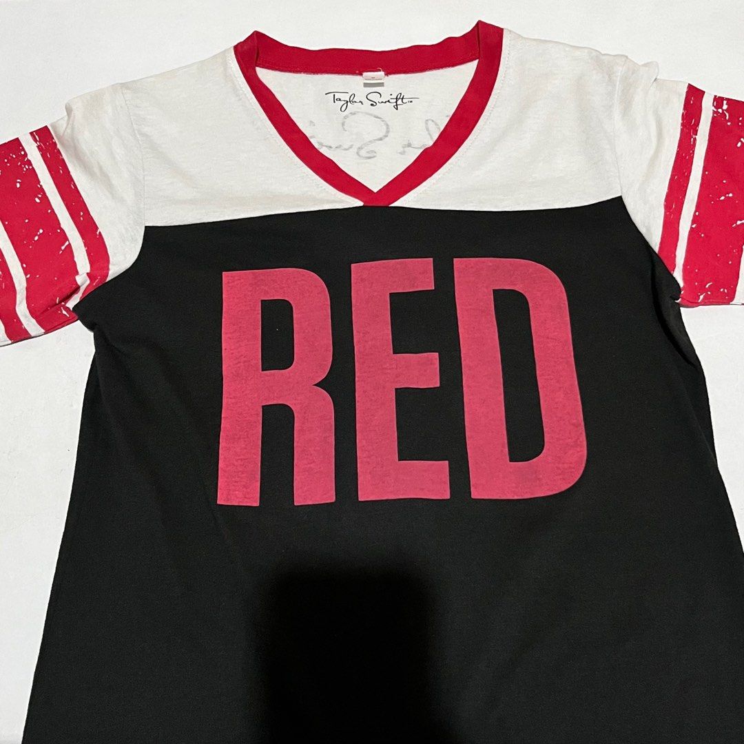 Taylor Swift Red T-Shirt (Category: Shirts) located in Quezon City. Submitted by annmalabanan (Listing ID 1331817730, Image 1). Description: Official Red Tour Merchandise Medium US Women Size Width - 16in Length- 24.5in Never been worn Location: Palmera Homes, Novaliches QC.