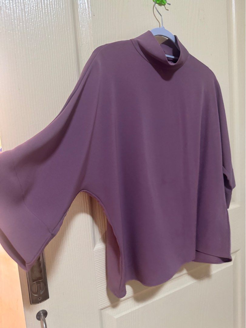 Uniqlo Lavander 3/4 tops (Category: Blouses) located in Bacoor. Submitted by _ibyangf (Listing ID 1331911860, Image 3). Description: Bought at Uniqlo shop Size: M Used 2-3x only can pass as good as new if not for the barely noticeable stain as seen on pics MOP: gcash/paymaya J&T Sf c/o buyer.