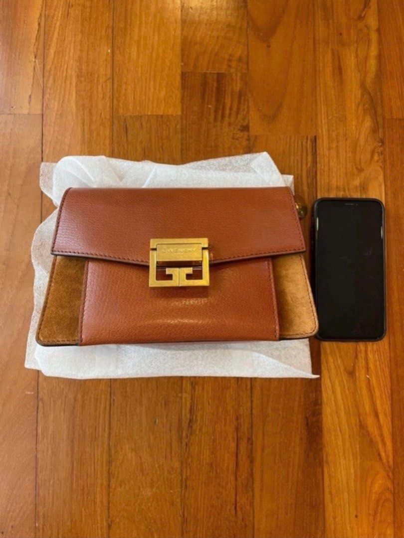 Givenchy bag (Category: Clutches) located in Singapore. Submitted by njsb000 (Listing ID 1331967289, Image 1). Description: Two faint scratches, but hard to see unless you scrutinize. Comes with original dustbag. Otherwise, excellent condition .