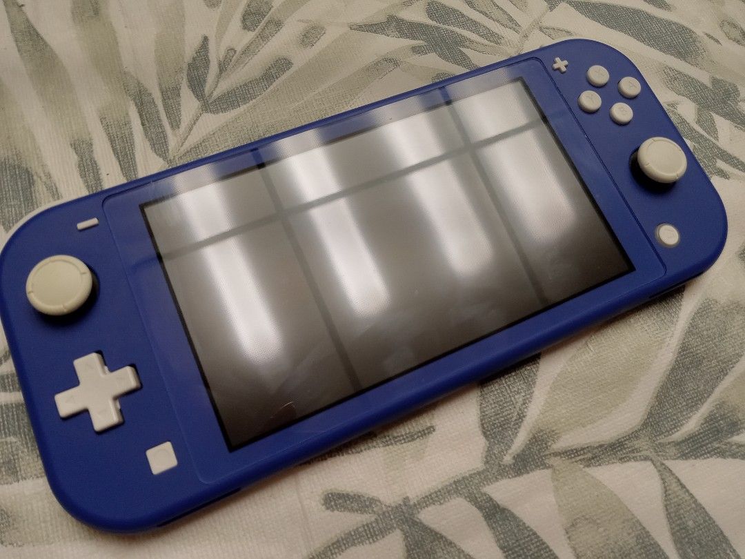 Nintendo switch lite - royal blue (Category: Electronics & Gadgets Others) located in Toronto. Submitted by melody.d (Listing ID 1332101072, Image 3). Description: Barely used Nintendo switch Lite in royal blue colour. Excellent condition. No chips, or scratches..