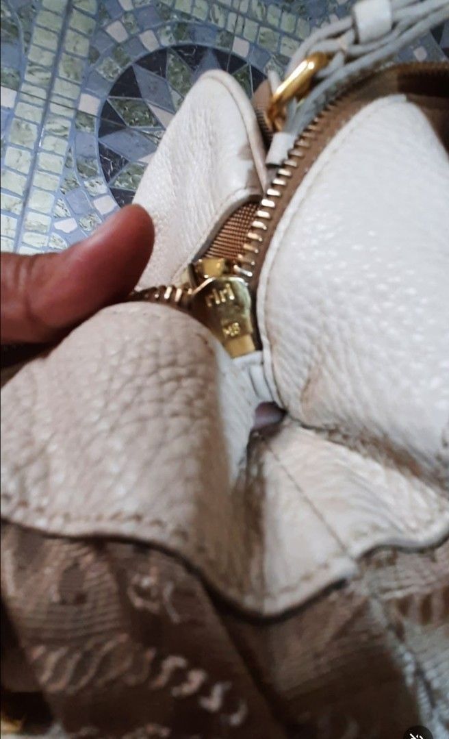 Prada Shoulder bag (Category: Luxury Bags & Wallets) located in Marikina City. Submitted by laila15 (Listing ID 1322786042, Image 1). Description: No sling inclusion may konting stain sa canvas Available.