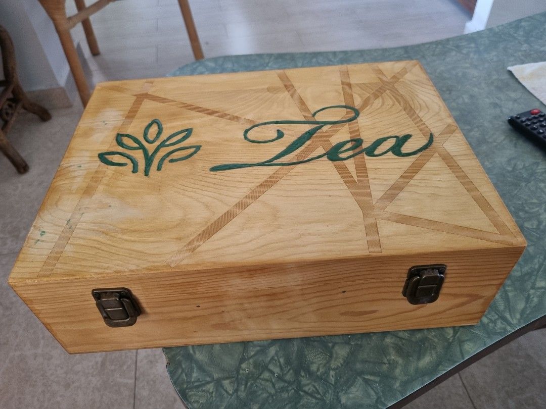 Tea box (Category: Storage Boxes & Baskets) located in Singapore. Submitted by joanathanpillay (Listing ID 1331975310, Image 1). Description: hand crafted tea box for 9 types of tea bags. its hand made from a wine crate. 100% re-cycled. cash and collect from pasir ris or yr nearest mrt station.if payment made in advance by pay now..