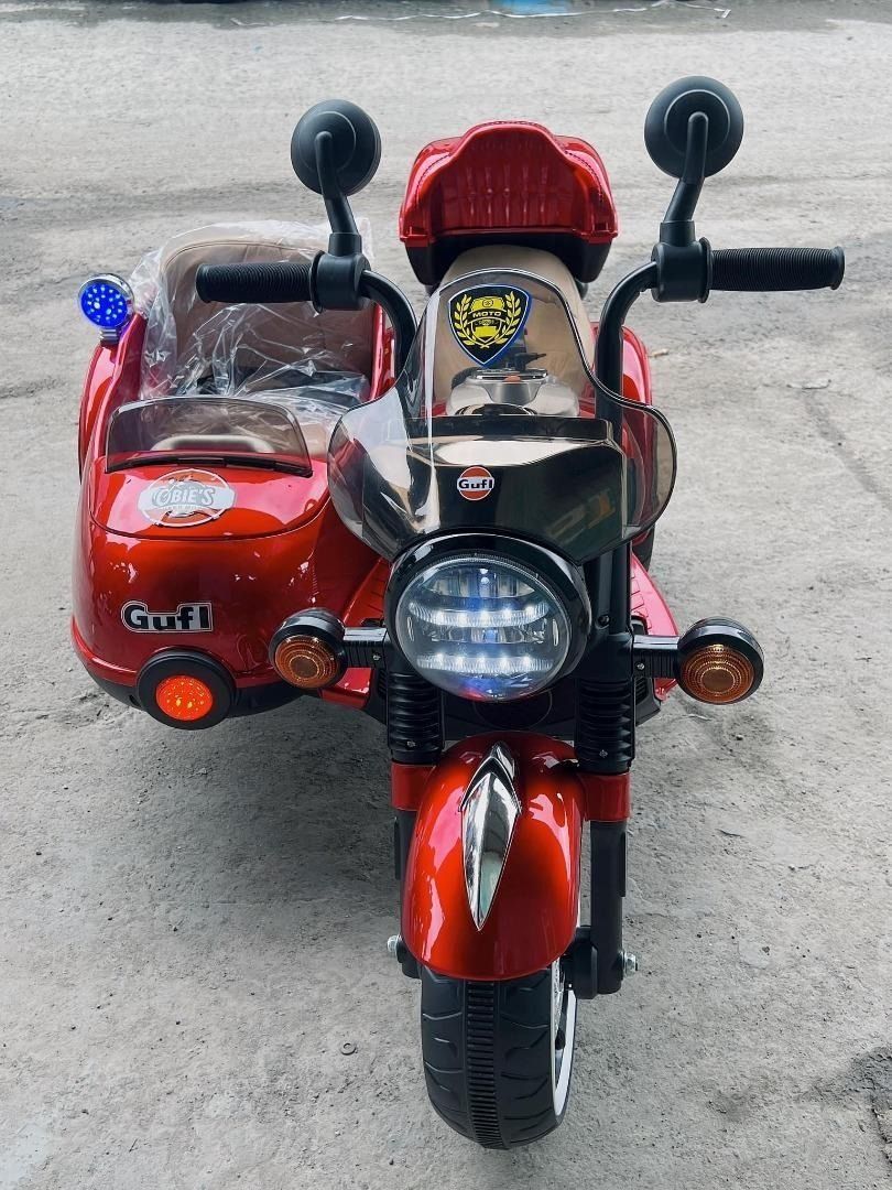 Electric Sidecar Motorcycle for kids(code 1916) (Category: Kids Toys) located in Pasay City. Submitted by bravefalcon.8b60e2 (Listing ID 1332244714, Image 1). Description: Electric Sidecar Motorcycle for kids(code 1916) Price: 9,500 PHP Color Available: Black, and Red 🔵Brand new 🔵Product size: 125x80x80cm 🔵Suitable for 1-8 years old 🔵Maximum weight capacity: 70kgs 🔵High-quality plastic wheels 🔵Battery:12v7A 🔵With Microphone/ Light and Musi