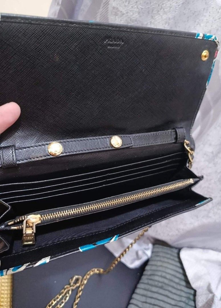Prada Sling Wallet (Category: Luxury Bags & Wallets) located in Cebu City. Submitted by charmaineb60300 (Listing ID 1332109020, Image 3). Description: Lightly Used Source: Ukay Soccer Bale.