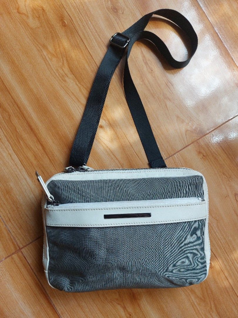 Preloved Calvin K. crossbody bag (Category: Luxury Bags & Wallets) located in Davao. Submitted by wengbagstuff (Listing ID 1332161040, Image 2). Description: ❤️ Preloved C K crossbody bag 🍀 leather & thick nylon canvass 🍀 gun metal hardwares 🍀 no runs, holes or tear, light signs of usage.