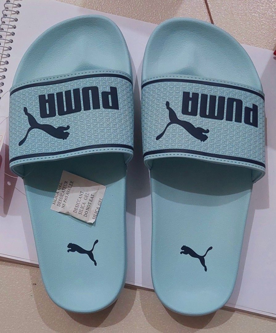 ORIGINAL PUMA SLIDES (Category: Slippers and slides) located in Quezon City. Submitted by letsdecluttermanila (Listing ID 1332256665, Image 1). Description: used once lang in the mall mukhang bago pa din..no box na po kasi may shoe box naman kami sa house comfy sa paa but a bit big lang for me kaya sell o nalang.