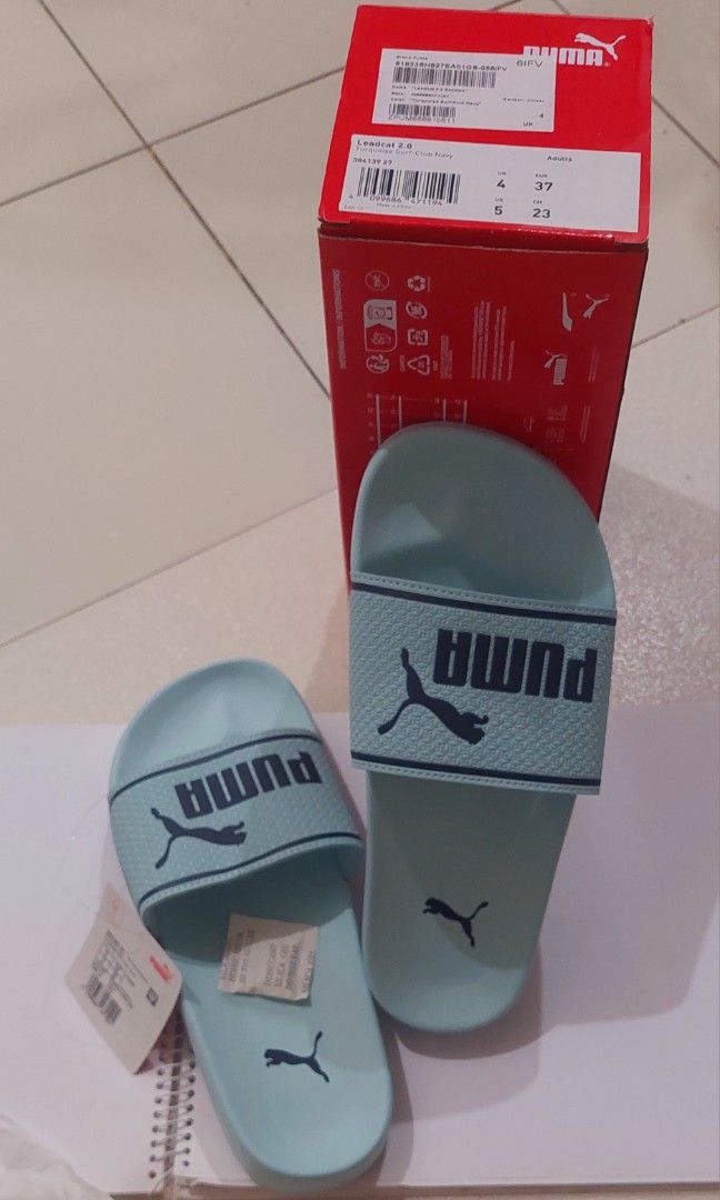 ORIGINAL PUMA SLIDES (Category: Slippers and slides) located in Quezon City. Submitted by letsdecluttermanila (Listing ID 1332256665, Image 2). Description: used once lang in the mall mukhang bago pa din..no box na po kasi may shoe box naman kami sa house comfy sa paa but a bit big lang for me kaya sell o nalang.