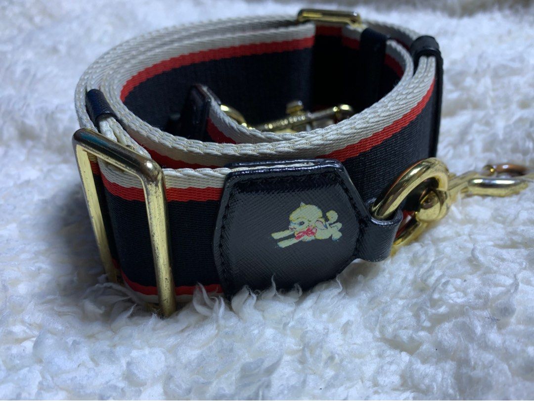 Authentic Marc Jacobs Wide Bag Strap (Category: Luxury Bags & Wallets) located in Rosario. Submitted by myvinatgepieces (Listing ID 1332428744, Image 1). Description: Authentic Marc Jacobs Bag Strap Very Good Used Condition 1 Side Faded Dog Print Slightly Faded Lobster Claw Hook adjustable shoulder strap gold-tone hardware Composition Polyester 100% No Inclusions.