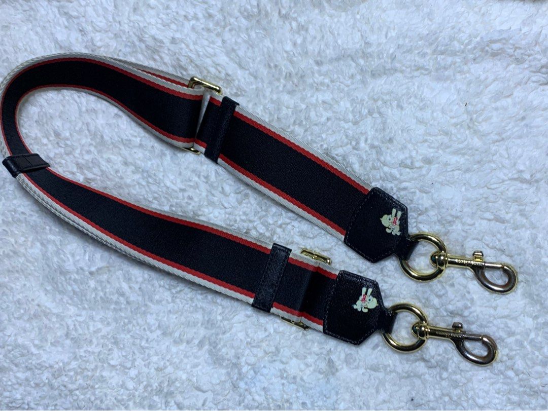 Authentic Marc Jacobs Wide Bag Strap (Category: Luxury Bags & Wallets) located in Rosario. Submitted by myvinatgepieces (Listing ID 1332428744, Image 3). Description: Authentic Marc Jacobs Bag Strap Very Good Used Condition 1 Side Faded Dog Print Slightly Faded Lobster Claw Hook adjustable shoulder strap gold-tone hardware Composition Polyester 100% No Inclusions.