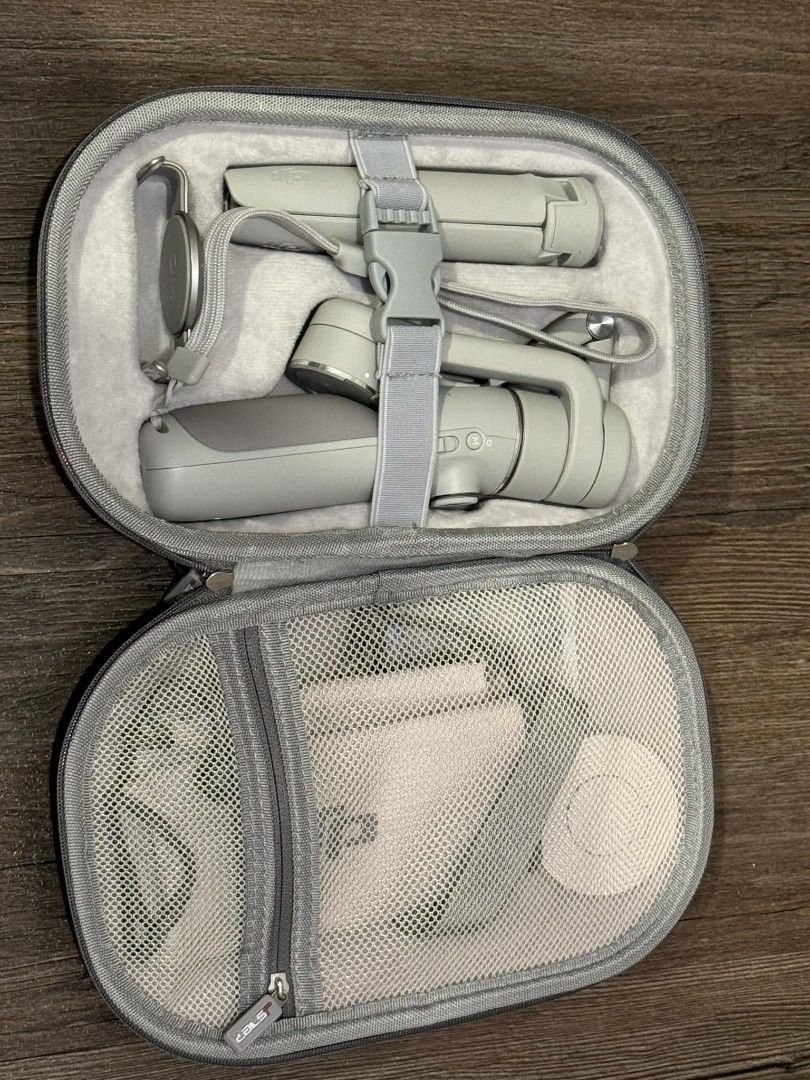 DJI Osmo 4 Mobile Package (Category: Cameras) located in Quezon City. Submitted by softboiledtamago (Listing ID 1332286660, Image 1). Description: Includes: 1. DJI Osmo Mobile 4 2. Tripod attachment 3. Smartphone magnetic clamp 4. Magsafe attachment to directly attach Magsafe compatible phones 5. Official pouch 6. Hard case ***Product will be available on January***.