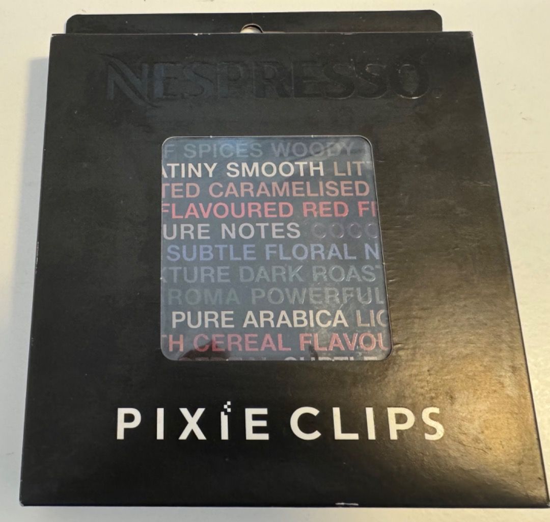 NESPRESSO Pixie Clips (Category: Coffee Machines & Makers) located in Singapore. Submitted by mickeysim79 (Listing ID 1332301416, Image 1). Description: One Plate Black with wordings and another in yellow In original packaging .