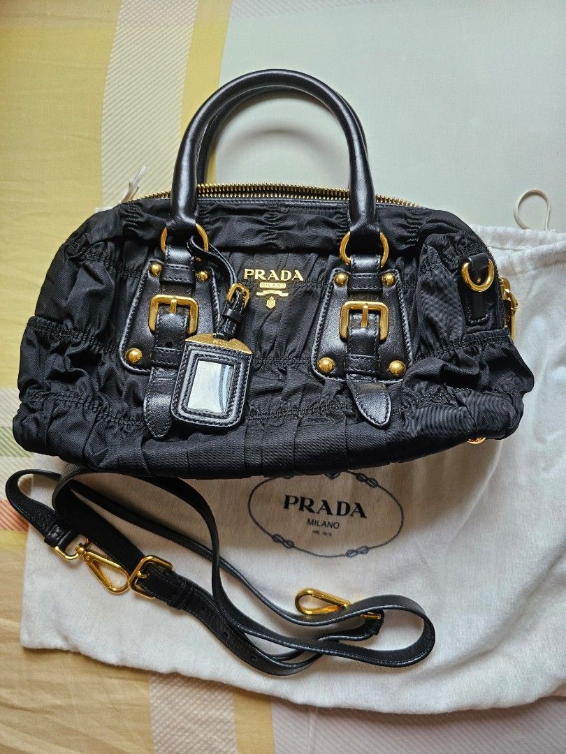 Prada Classic Black Sling Bag (Category: Luxury Bags & Wallets) located in Davao. Submitted by declutter14 (Listing ID 1332350632, Image 1). Description: Preloved Authentic PRADA Black Tessuto Gaufre Ruched Handbag Sling Bag with dustbag & long strap BAWAL SA BARAT. NOT UKAY² PAYMENT: PALAWAN SG BASED DIRECT SHIPPING SG TO PH 35,000Freesf.