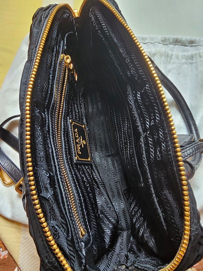 Prada Classic Black Sling Bag (Category: Luxury Bags & Wallets) located in Davao. Submitted by declutter14 (Listing ID 1332350632, Image 3). Description: Preloved Authentic PRADA Black Tessuto Gaufre Ruched Handbag Sling Bag with dustbag & long strap BAWAL SA BARAT. NOT UKAY² PAYMENT: PALAWAN SG BASED DIRECT SHIPPING SG TO PH 35,000Freesf.