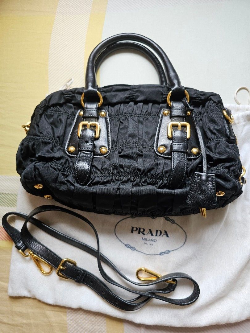 Prada Classic Black Sling Bag (Category: Luxury Bags & Wallets) located in Davao. Submitted by declutter14 (Listing ID 1332350632, Image 2). Description: Preloved Authentic PRADA Black Tessuto Gaufre Ruched Handbag Sling Bag with dustbag & long strap BAWAL SA BARAT. NOT UKAY² PAYMENT: PALAWAN SG BASED DIRECT SHIPPING SG TO PH 35,000Freesf.