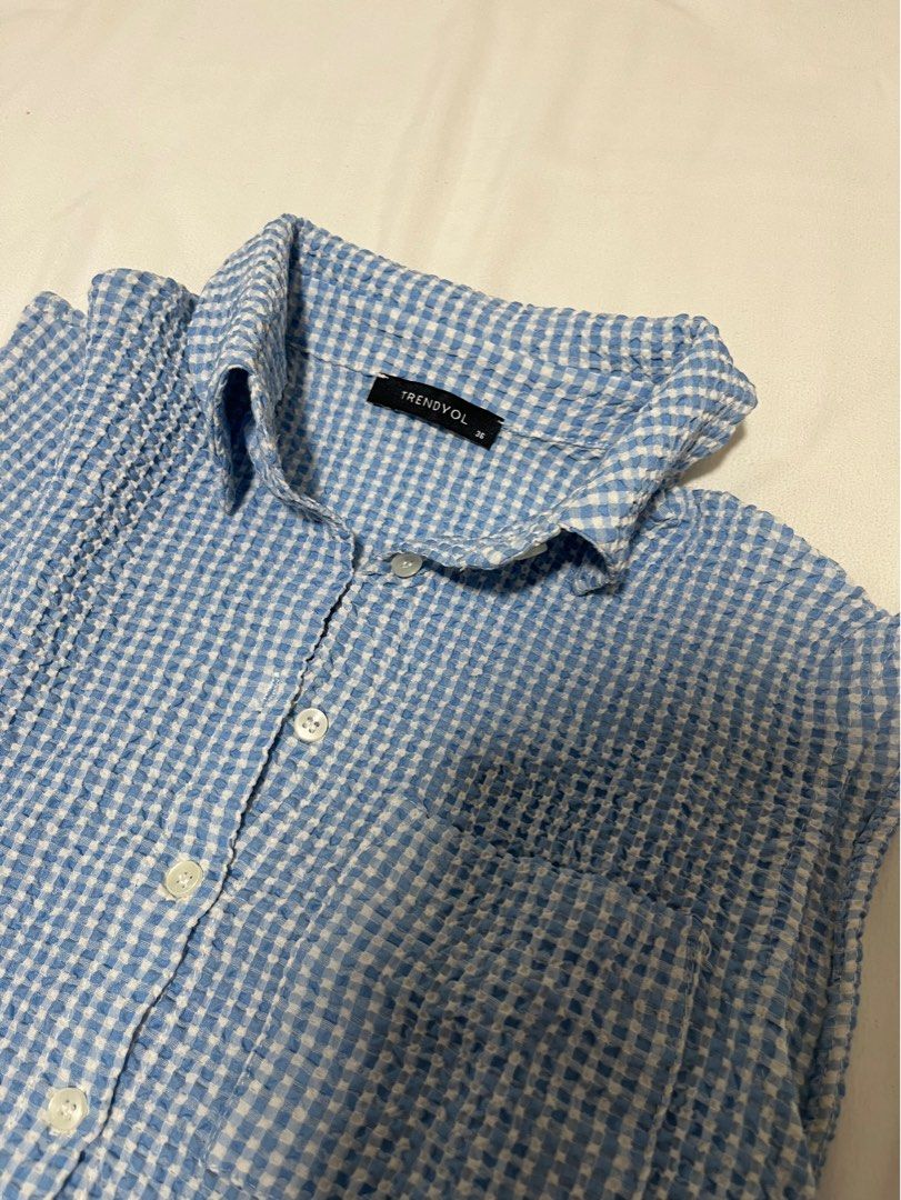 Blue Plaid Sleeveless Shirt (Category: Shirts) located in Quezon City. Submitted by d3clutters (Listing ID 1332474959, Image 2). Description: — bought from zalora; priced at 370 — worn a few times only — mop: gcash/bpi.
