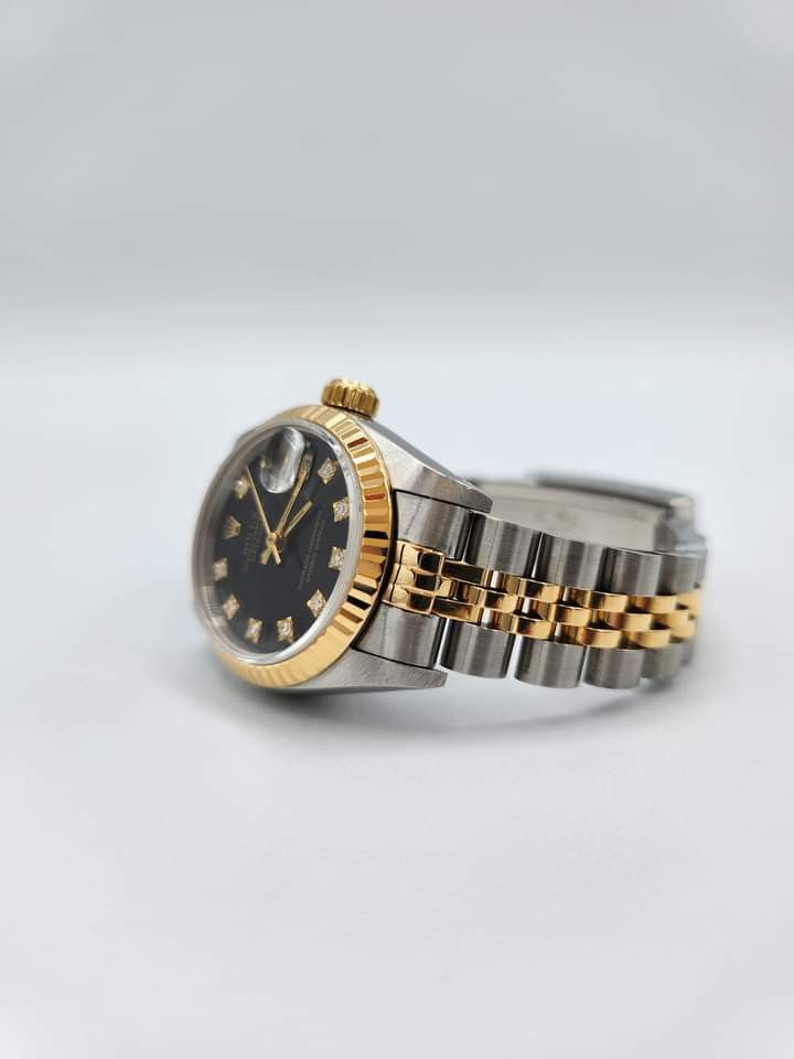 Rolex (Category: Luxury Watches) located in Las Pinas. Submitted by calmphoenix.234114 (Listing ID 1332554196, Image 3). Description: 1990 Rolex Lady-Datejust Two-Toned 69173 Black Diamond Dial - 26mm 18k Yellow Gold Two-Toned Jubilee Bracelet 18k Yellow Gold Fluted Bezel Caliber 2135 (Automatic), Power Reserve 40h Box/Paper: Yes/No (Watch only) Condition Rating: 9.8/10 Inclusions: Rolex Box, Rolex Service Pouch, Acrylic Transport Case Selling Pr