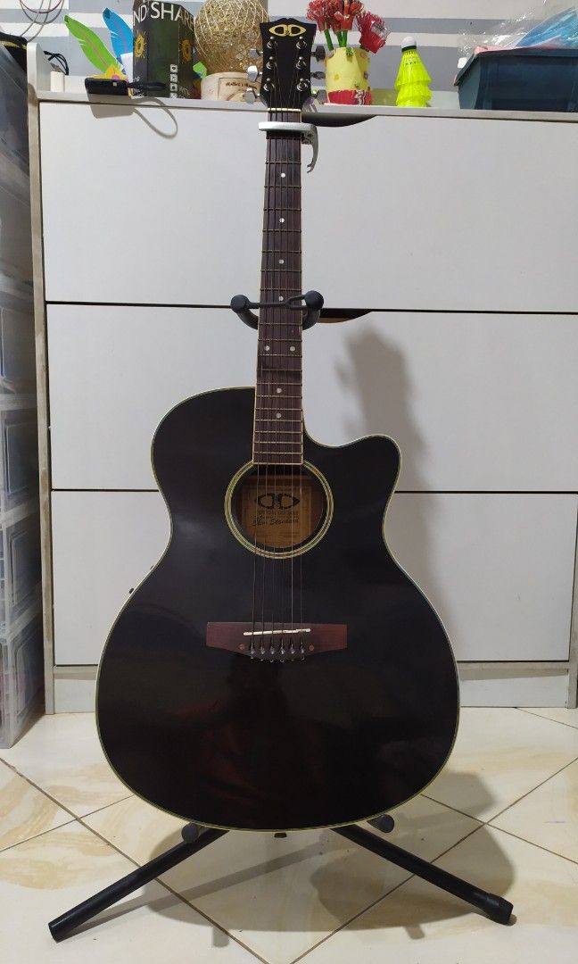 D&D Slim Standard Acoustic Guitar (Category: Musical Instruments) located in Malolos. Submitted by noshfild (Listing ID 1332722896, Image 1). Description: D&D Slim Standard Acoustic Guitar Black with built-in tuner with free capo with free stand with standard guitar bag high action - selling as is for pick up only at Malolos, Bulacan fixed price.