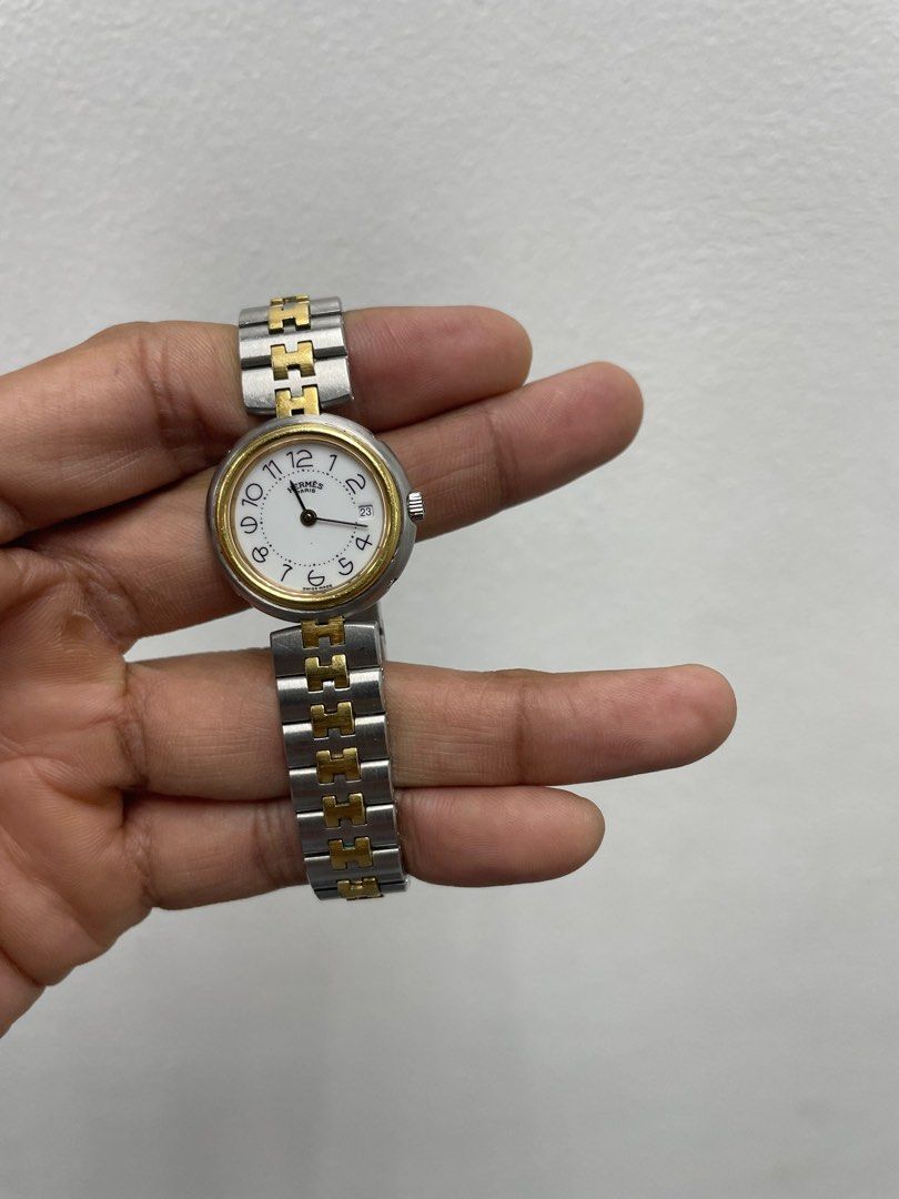 HERMES Profile Two-tone Ladies' Watch (Category: Luxury Watches) located in Manila. Submitted by luxemax_09 (Listing ID 1332730115, Image 1). Description: Gender: Ladies’ Reference #: 436365 Movement: Quartz Case Size: 25mm / 26mm (with crown) Case Material: Stainless steel Strap Size: 6.5” / 7.5” (with face) Crystal: Sapphire Water Resistance: 30m Dial Type/Color: Analog / White Calendar: Date display Band Type: Bracelet Band Material: Stainless