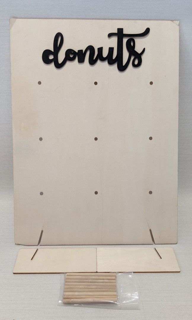 Mini-Donut Board for event (Category: Other Home Decor) located in Mandaluyong City. Submitted by clf97 (Listing ID 1332692068, Image 2). Description: Collapsible mini donut board for event, nine pegs. 10.25" x 14" Some damage on corners, one blue pen streak..