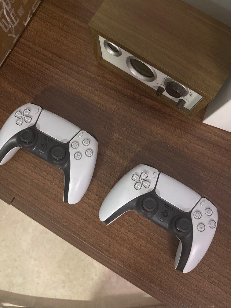 PS5 controller white (Category: Controllers) located in Singapore. Submitted by dlo_yolo (Listing ID 1332769403, Image 1). Description: Barely used. 1 for $50 2 for $90.